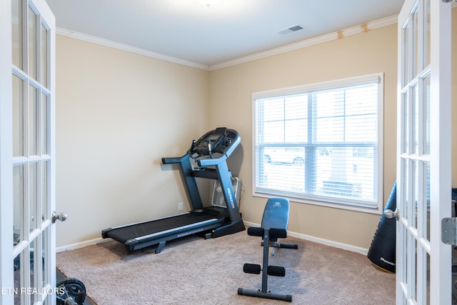 exercise room with light carpet, french doors, and crown molding