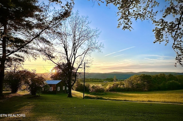 yard at dusk with a mountain view