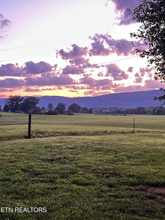 mountain view featuring a rural view