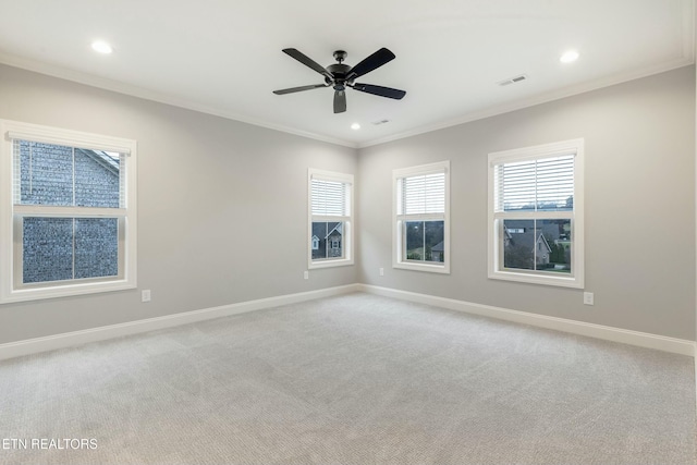 unfurnished room featuring light carpet, ceiling fan, and ornamental molding