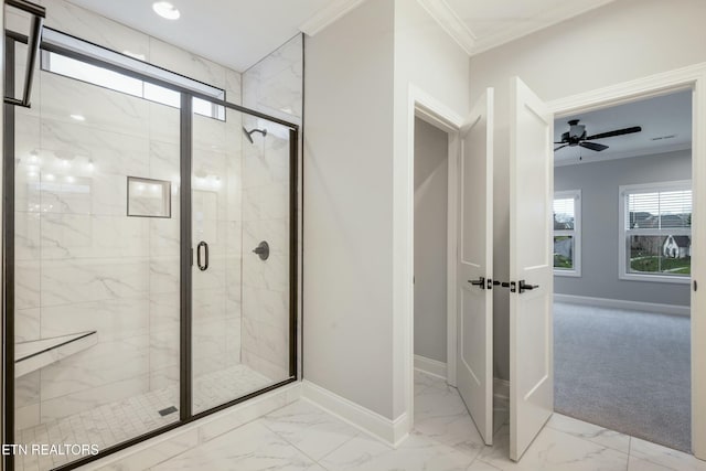 bathroom featuring crown molding, ceiling fan, and a shower with shower door