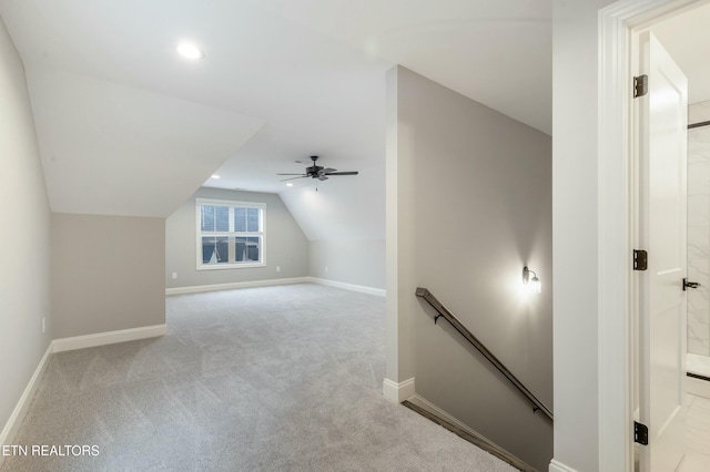 bonus room with light colored carpet, ceiling fan, and lofted ceiling