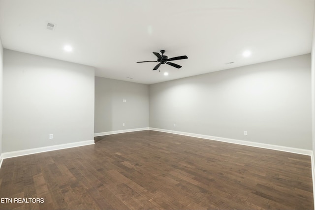 unfurnished room featuring dark hardwood / wood-style floors and ceiling fan