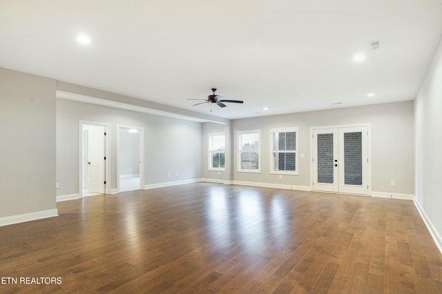 unfurnished living room featuring french doors, dark hardwood / wood-style flooring, and ceiling fan