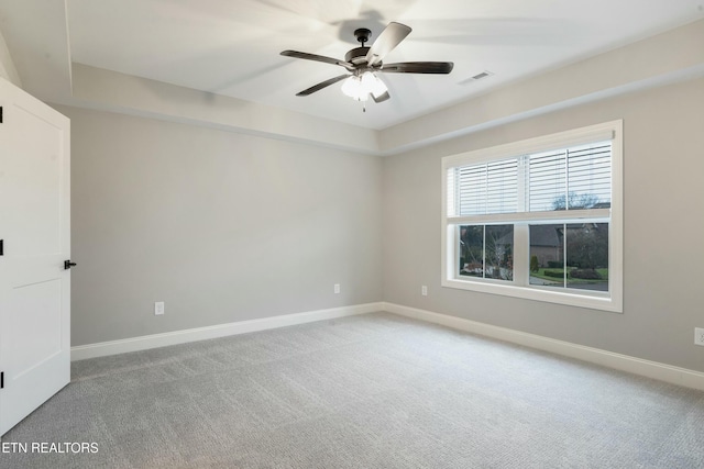 unfurnished room featuring ceiling fan and carpet floors