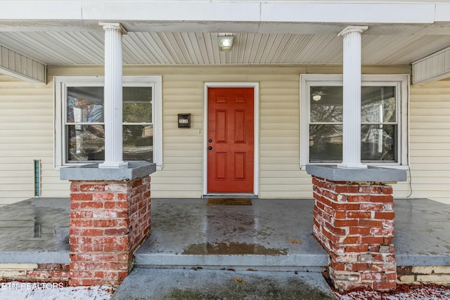 doorway to property featuring a porch