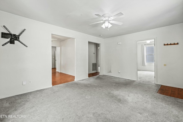 carpeted empty room with ceiling fan