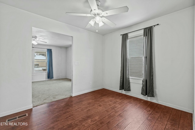 spare room featuring hardwood / wood-style flooring and ceiling fan