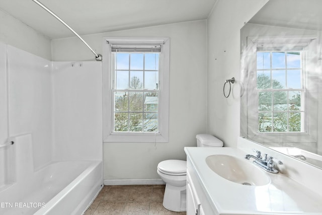 full bathroom featuring vanity, a healthy amount of sunlight, lofted ceiling, and tub / shower combination