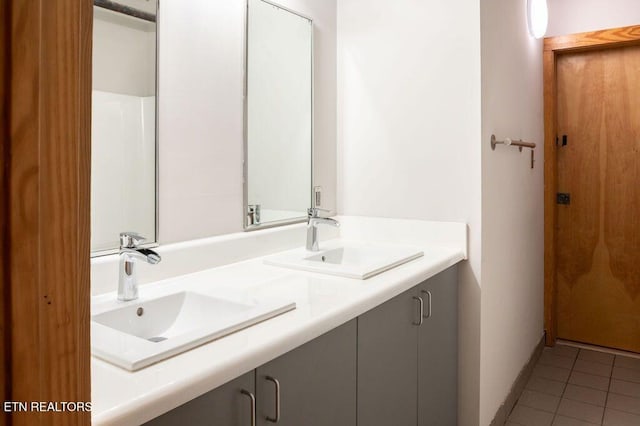 bathroom featuring tile patterned floors and vanity