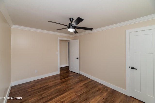 spare room featuring ceiling fan, dark hardwood / wood-style flooring, and ornamental molding