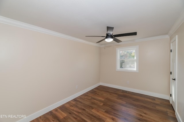 empty room featuring ceiling fan, dark wood-type flooring, and ornamental molding