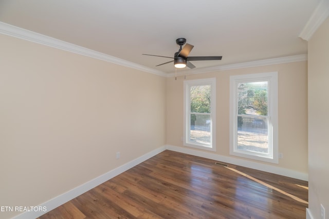 unfurnished room with ceiling fan, dark hardwood / wood-style flooring, and ornamental molding