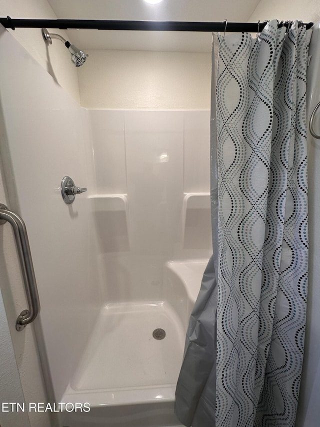 bathroom with a shower with curtain