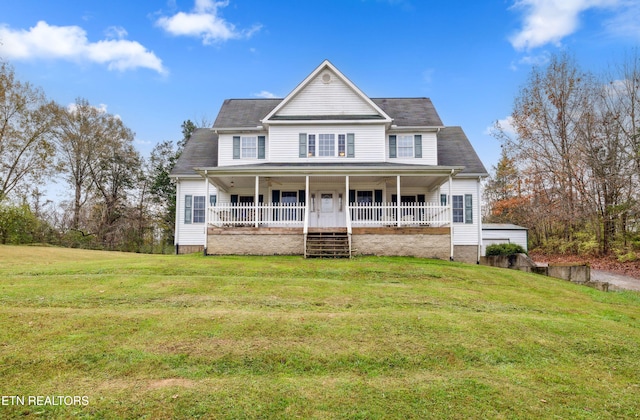 view of front of property with a porch and a front lawn