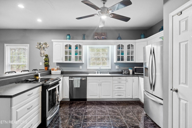 7987 Longmire Rd, Luttrell, TN 37779 - kitchen featuring white cabinetry, sink, ceiling fan, and stainless steel appliances