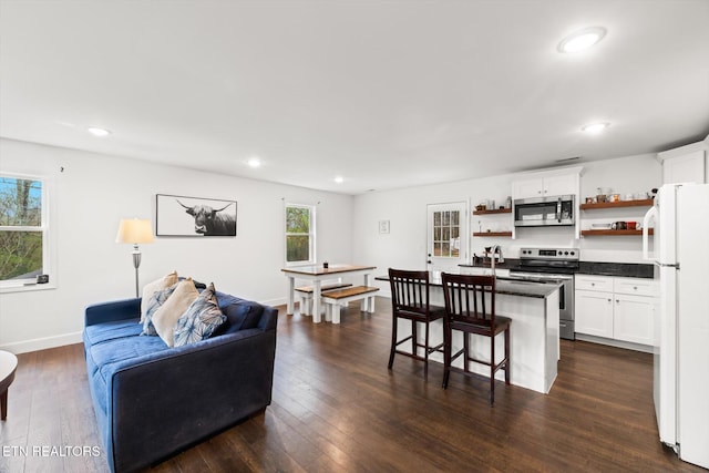 living room with dark wood-type flooring