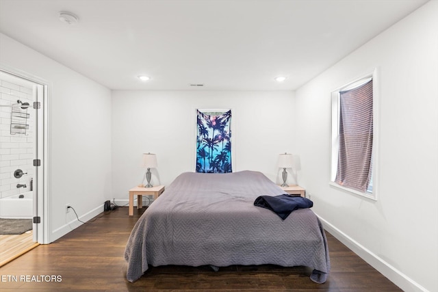 bedroom with dark wood-type flooring