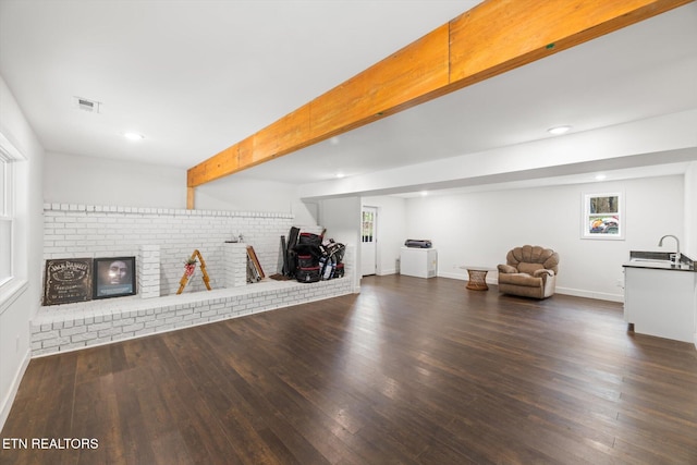 workout room featuring sink and dark hardwood / wood-style floors