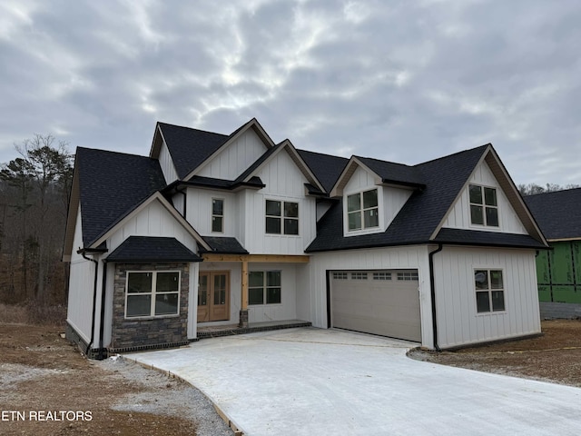 view of front of house featuring a garage and french doors