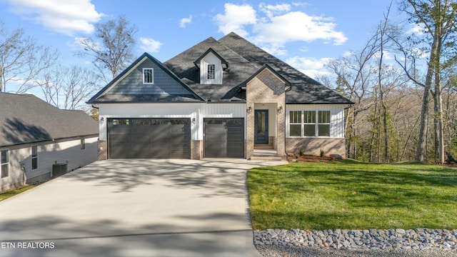 view of front of house featuring a front lawn and a garage