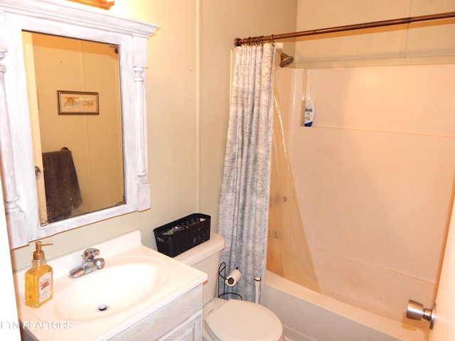 full bathroom featuring shower / tub combo, vanity, and toilet