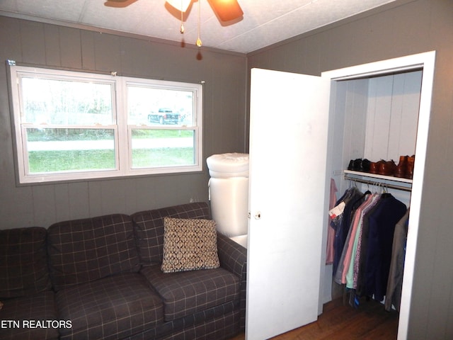 living room with ceiling fan and hardwood / wood-style flooring