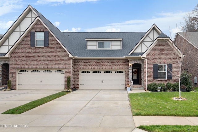 view of front facade with a front lawn and a garage