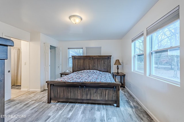 bedroom with hardwood / wood-style floors