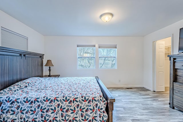 bedroom with light hardwood / wood-style floors