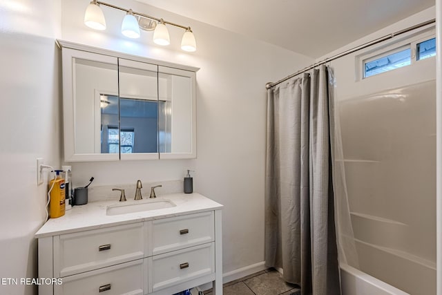 bathroom featuring tile patterned floors, shower / bath combo, and vanity