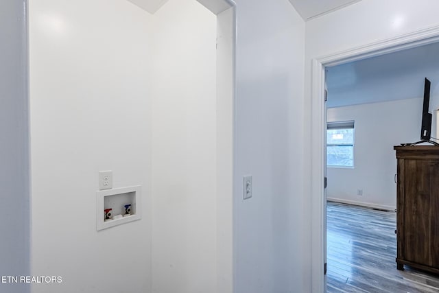 clothes washing area featuring washer hookup and hardwood / wood-style flooring