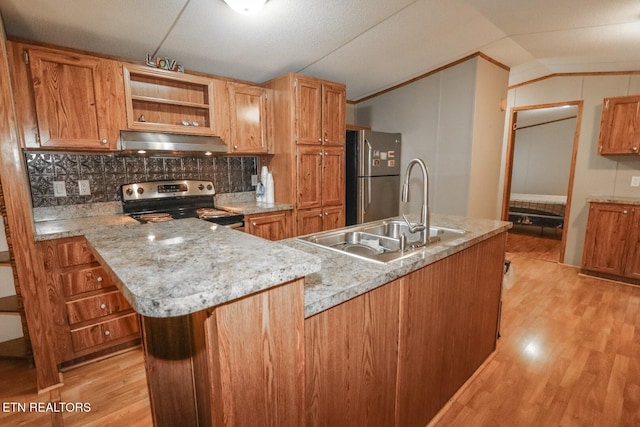 kitchen with sink, light hardwood / wood-style floors, lofted ceiling, decorative backsplash, and appliances with stainless steel finishes