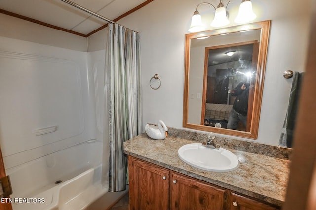 bathroom with shower / bath combination with curtain, crown molding, and vanity