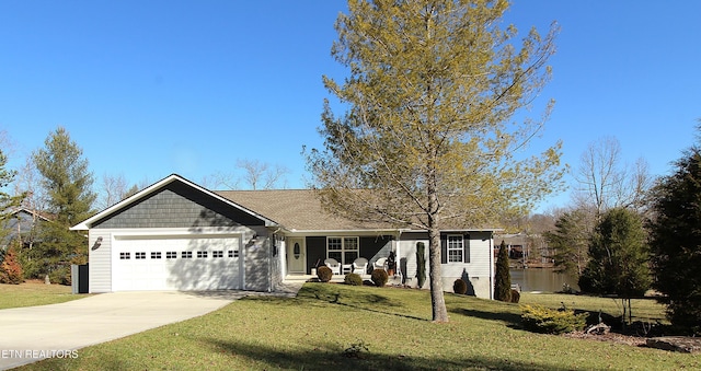 ranch-style home with a garage, a front yard, and driveway