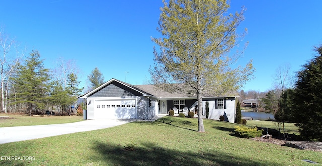 ranch-style house with an attached garage, concrete driveway, and a front yard