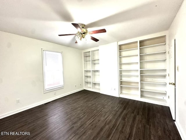 unfurnished bedroom featuring ceiling fan and dark hardwood / wood-style flooring