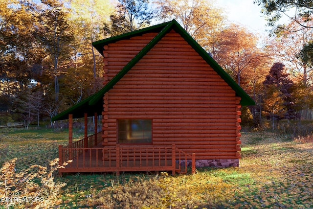 view of side of property with log exterior