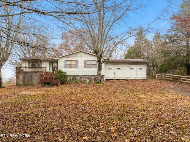 view of property exterior with a wooden deck