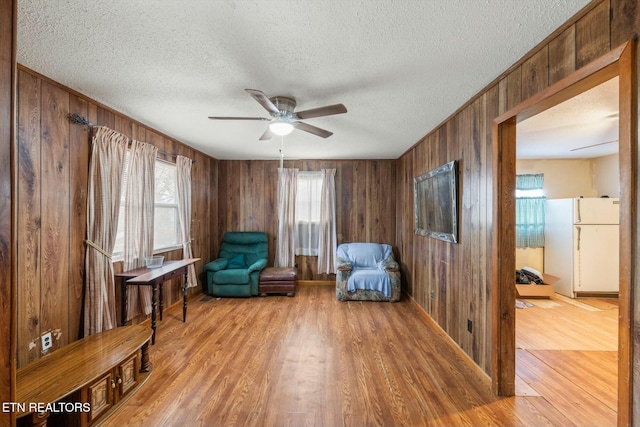 sitting room featuring hardwood / wood-style floors and a textured ceiling