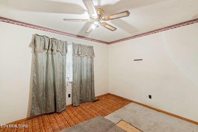 unfurnished room featuring carpet flooring and ceiling fan