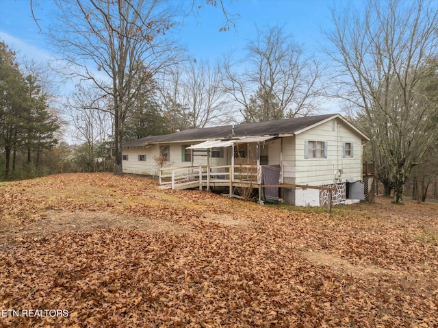 view of front of property with a wooden deck