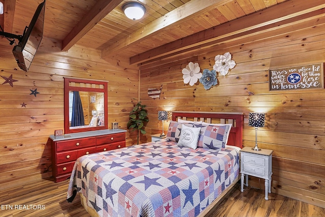 bedroom featuring beam ceiling, wooden ceiling, dark wood-type flooring, and wood walls