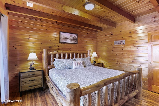 bedroom featuring beamed ceiling, wood ceiling, hardwood / wood-style floors, and wooden walls