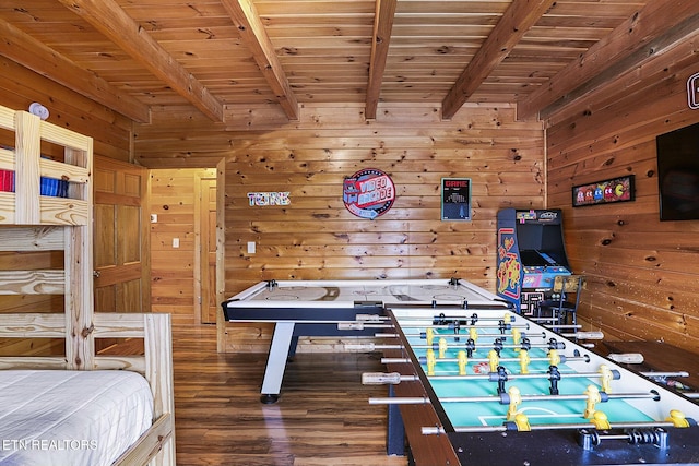 rec room featuring wood walls, beamed ceiling, wood ceiling, and hardwood / wood-style flooring