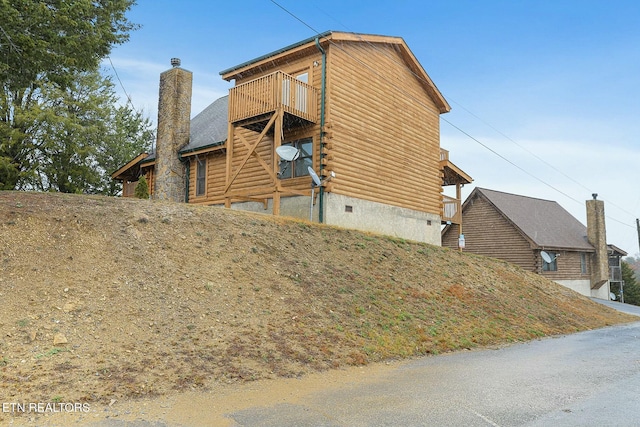 view of property exterior featuring a balcony