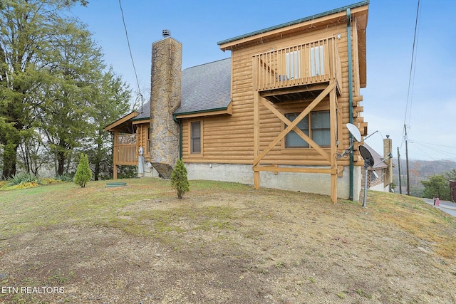 back of house with a balcony