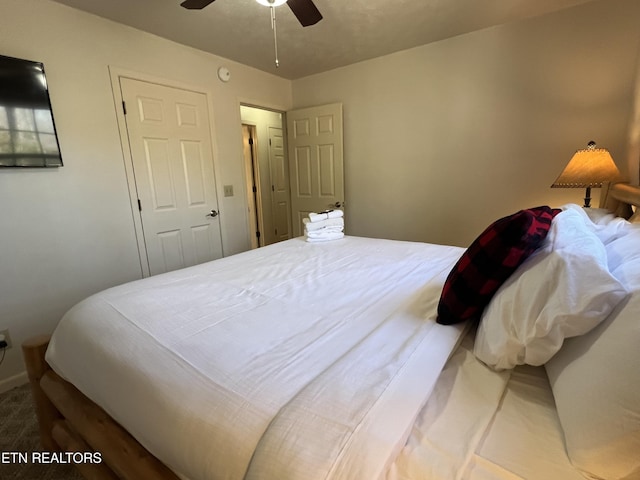 bedroom with ceiling fan, a closet, and carpet