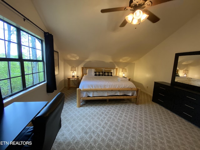 bedroom with carpet floors, ceiling fan, and lofted ceiling