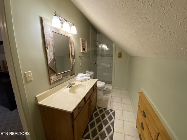 bathroom featuring tile patterned floors, walk in shower, vanity, a textured ceiling, and toilet